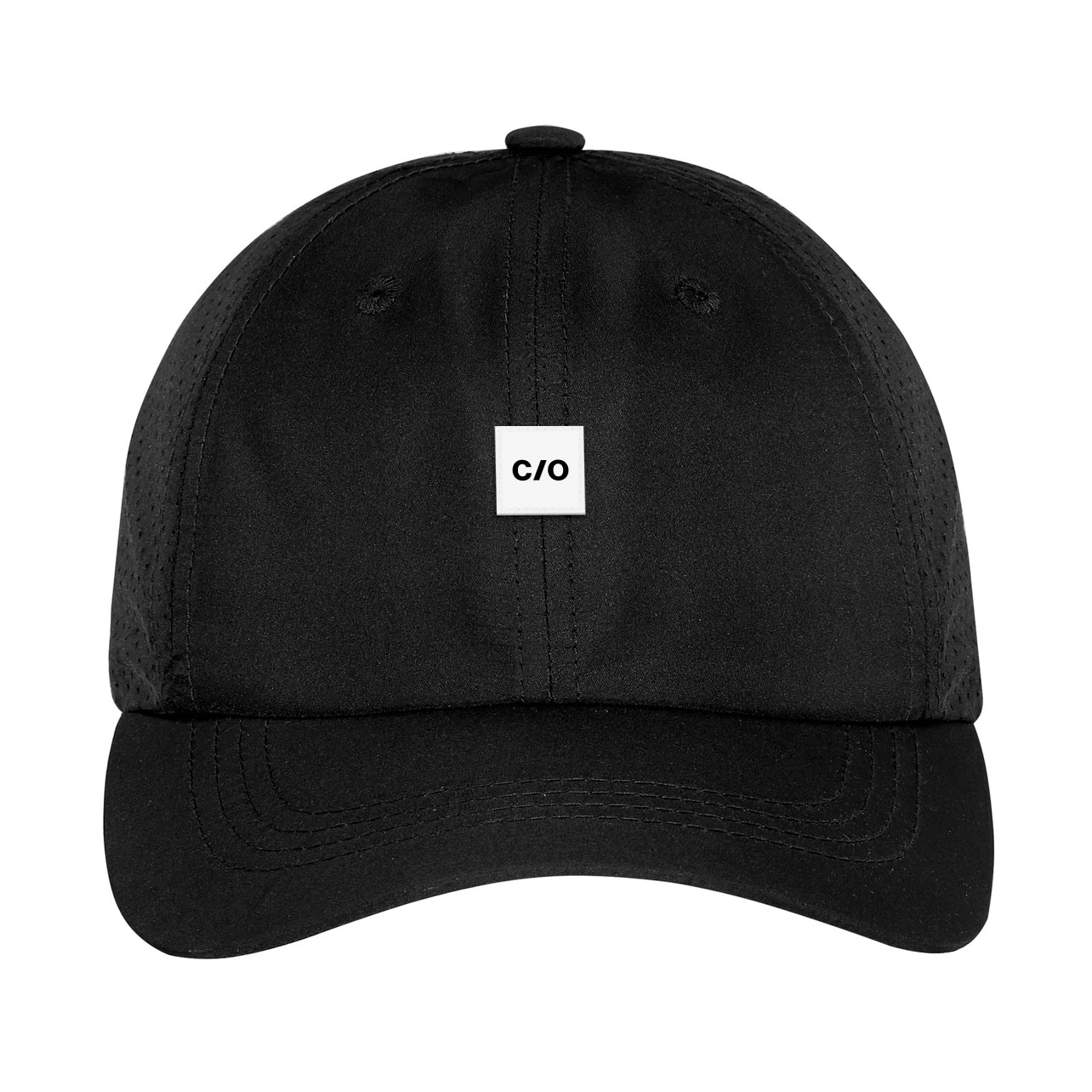 Front view of the Neue Performance Trucker Hat by Neue Supply Co. is perfect for the gym and working out in all black with perforated back panels