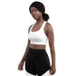 Woman wears Neue Supply Co. Longline Sports Bra in White. 3/4 view of model looking into camera with white background.