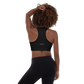 Woman wears Neue Supply Co. Essential Padded Sports Bra in Black. Back view of model.