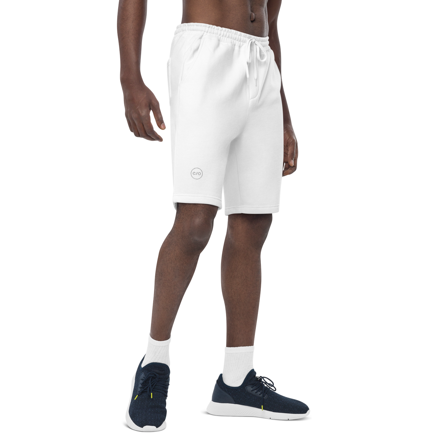 Man wearing Neue Supply Co. Men's Essential Fleece Sweat Shorts in White. 3/4 view of model on white background.