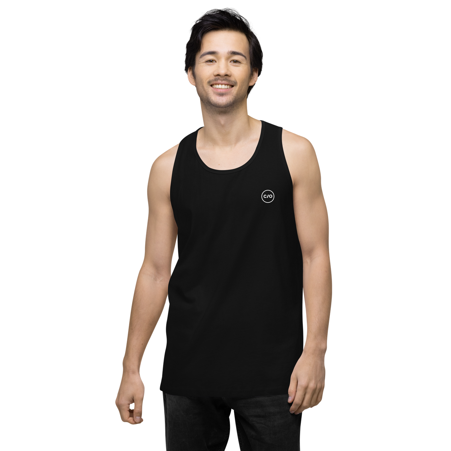 Man smiling and wearing Neue Supply Co. Essential Workout Tank Top for Men in Black